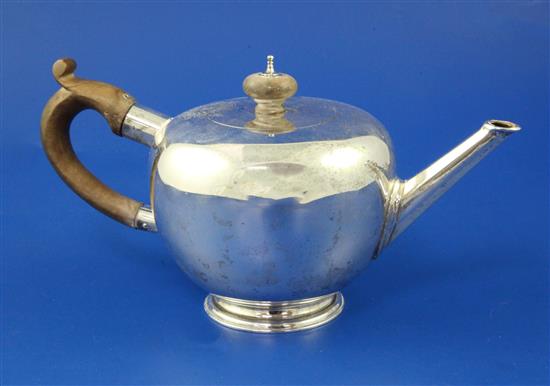 A modern 18th century style silver bullet shaped teapot by Garrard & Co Ltd, gross 16 oz.
